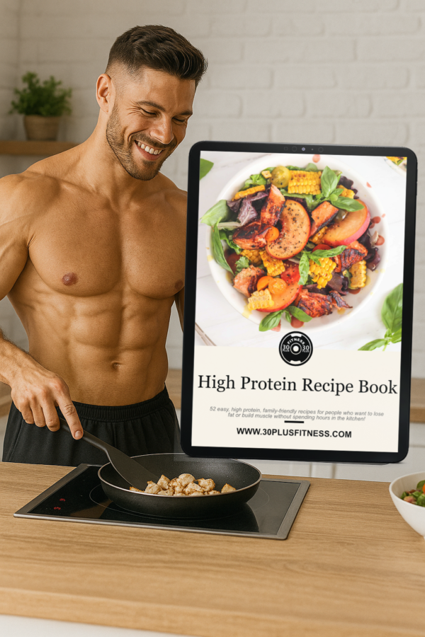 Muscular man cooking diced chicken in a modern kitchen, featuring high-protein recipes from 30 Plus Fitness